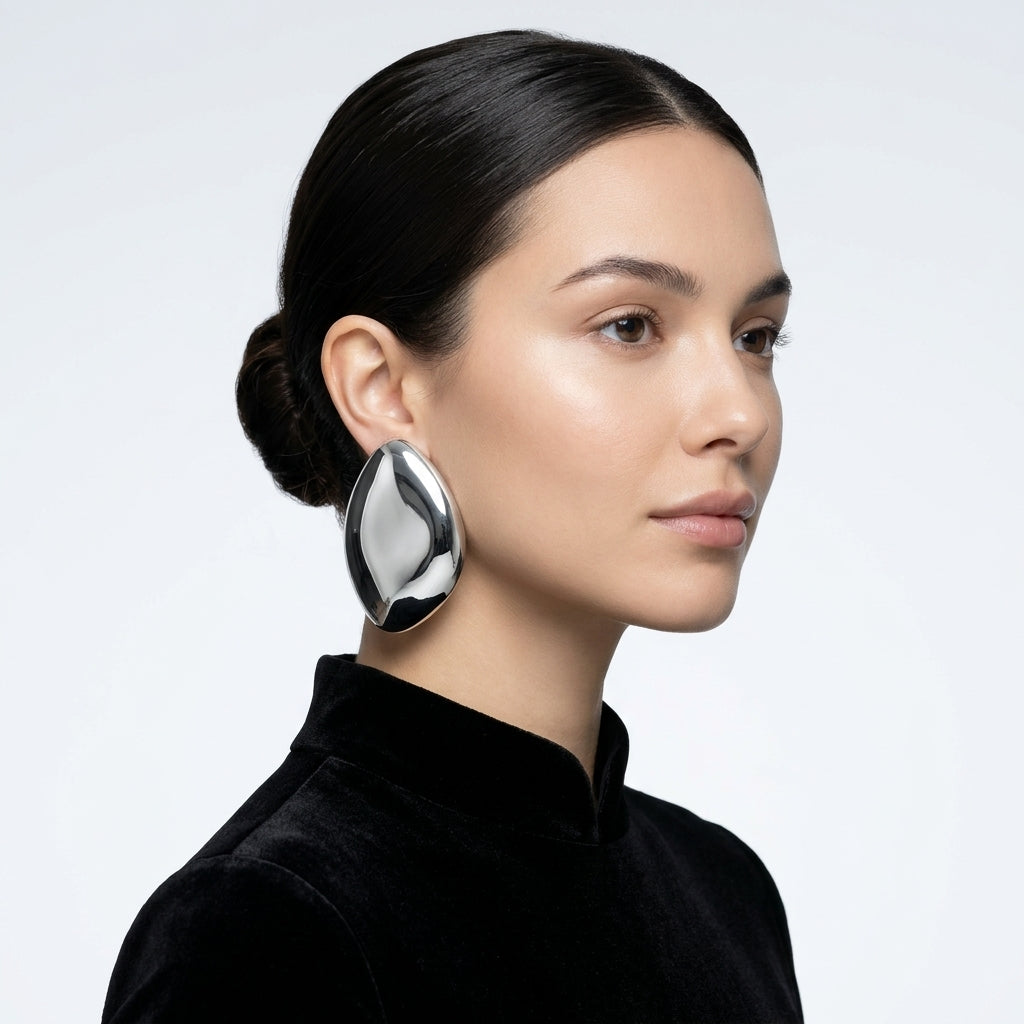 Model wearing a silver-tone Aurelia teardrop earring
